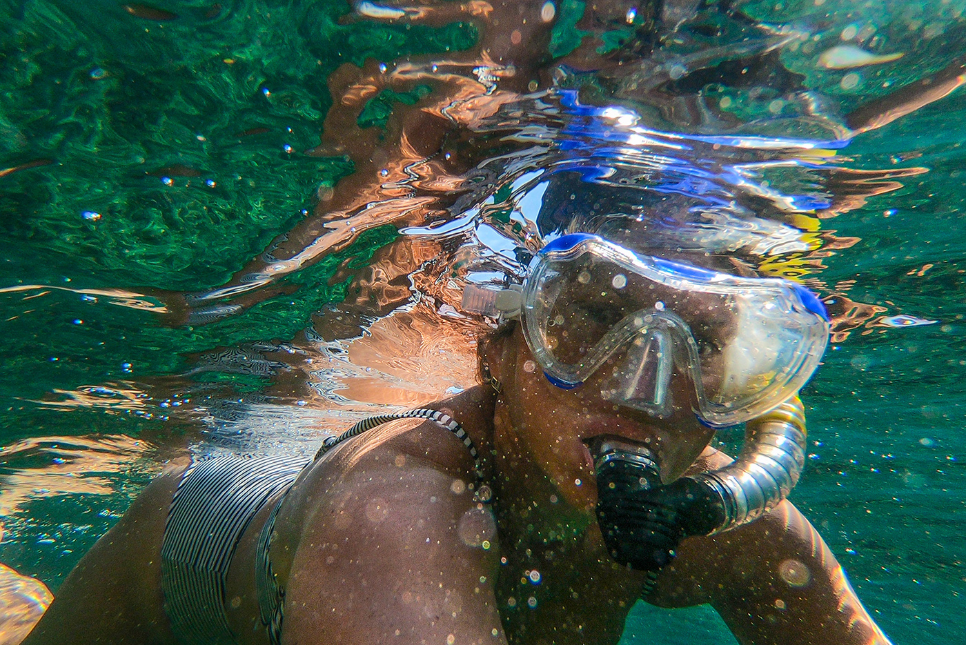 A snorkeler with mask and snorkel on for the article about snorkeling in Hawaii.